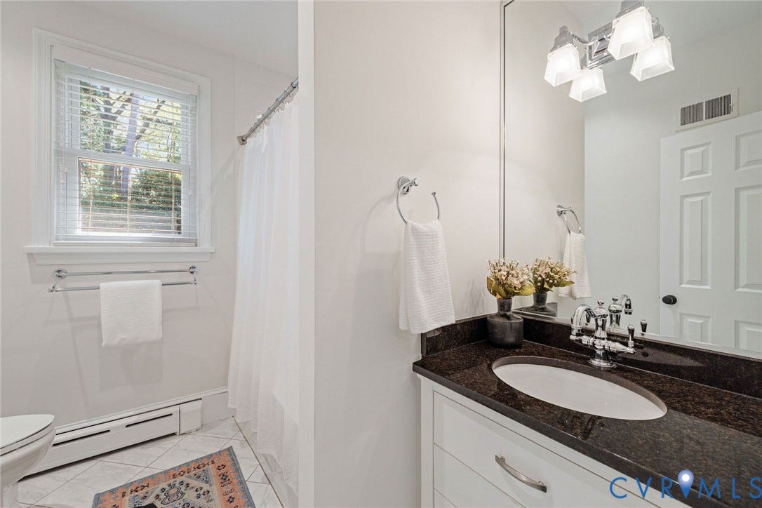6805 River Road, Westham Ridge, Henrico, VA 23229 Full hall bathroom with timeless finishes for Bedrooms 2 and 3.