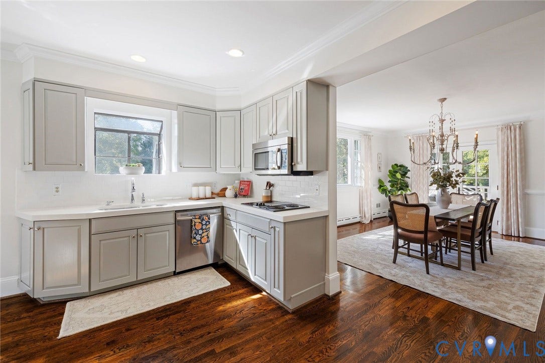 6805 River Road, Westham Ridge, Henrico, VA 23229 The open kitchen features quartz counters, stainless appliances and custom cabinets.