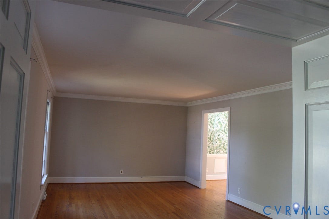 4101 Vauxhall, Chesterfield, VA 23234 Room featuring wood-finish flooring, crown molding, and wainscoting paneling details on the ceiling