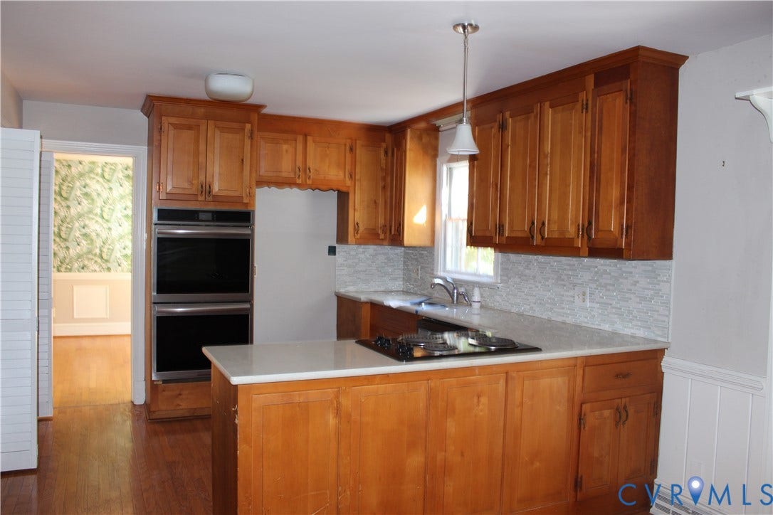 4101 Vauxhall, Chesterfield, VA 23234 Kitchen featuring wood cabinetry, integrated double wall ovens, a cooktop, stone-finish countertops, and a textured tile backsplash