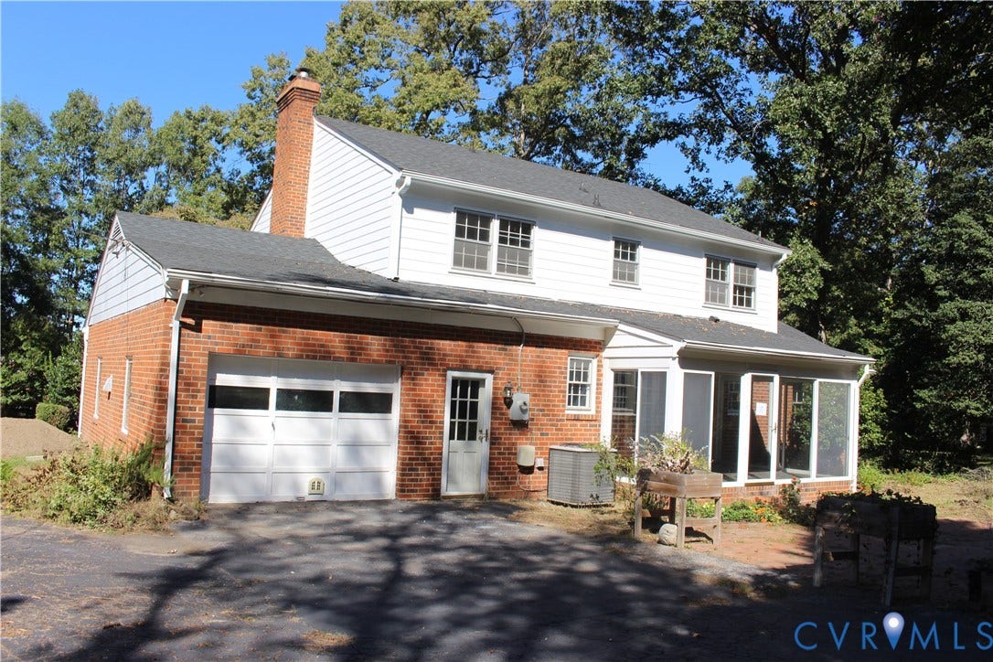 4101 Vauxhall, Chesterfield, VA 23234 Exterior featuring a combination of red brick and white horizontal siding, an attached garage, a brick chimney, and a screened-in porch