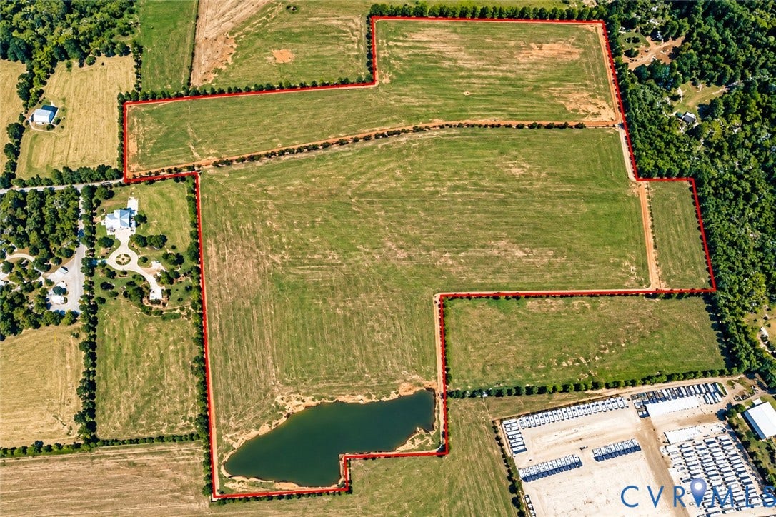 0 Walkers Pond Drive, Sutherland, VA 23885 Expansive acreage featuring cleared pasture land, established perimeter tree lines, and a dedicated pond