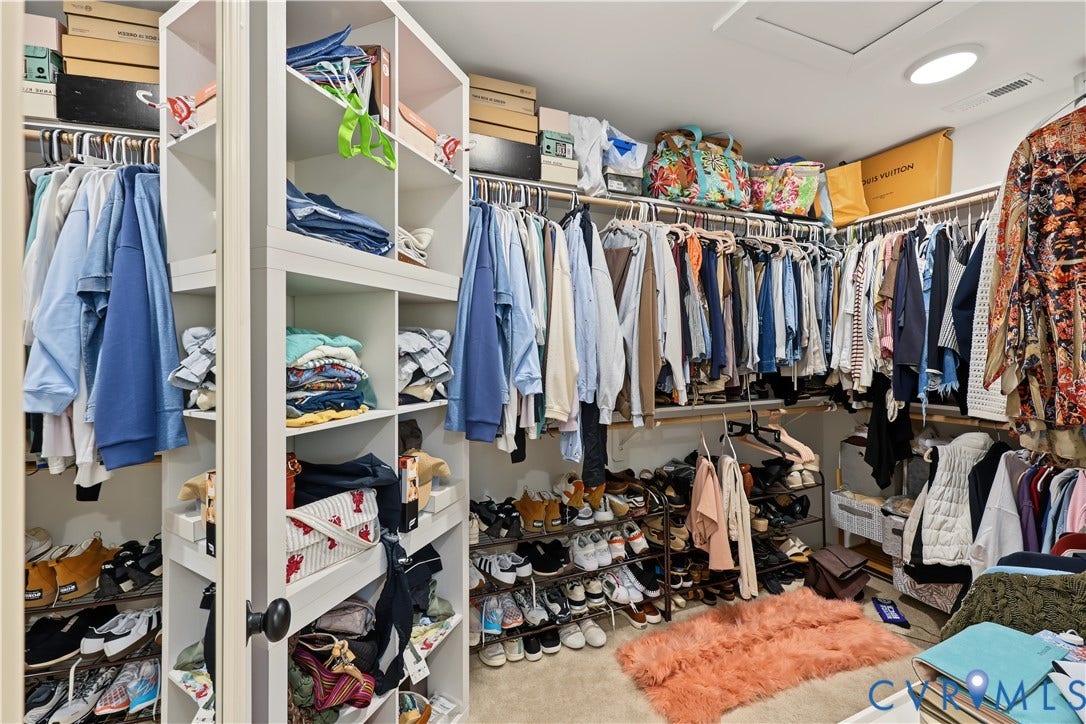 3851 County Line Road, Flemings Mill, Goochland, VA 23084 Walk-in closet featuring built-in white shelving towers and integrated hanging garment rods