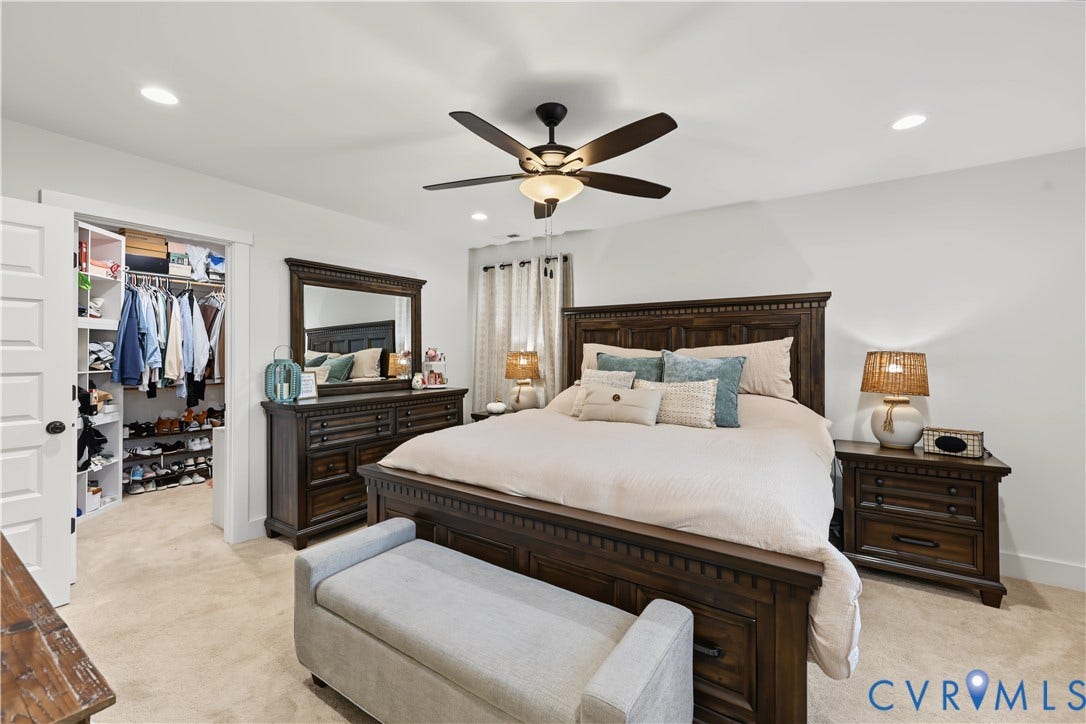 3851 County Line Road, Flemings Mill, Goochland, VA 23084 Bedroom featuring neutral wall paint, recessed lighting, carpet flooring, a central ceiling fan with integrated lighting, and a walk-in closet with built-in shelving