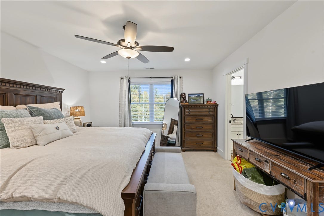 3851 County Line Road, Flemings Mill, Goochland, VA 23084 Bedroom featuring neutral carpeting, a multi-blade ceiling fan with integrated lighting, recessed lighting, and a doorway leading to a secondary room