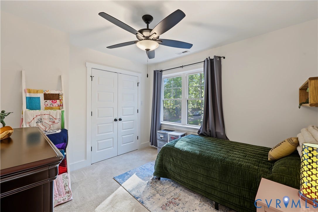 3851 County Line Road, Flemings Mill, Goochland, VA 23084 Bedroom featuring neutral wall paint, carpeted flooring, a ceiling fan with integrated lighting, a double-door closet, and a multi-pane window