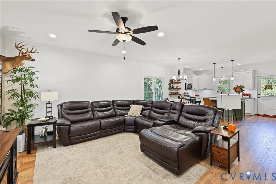 3851 County Line Road, Flemings Mill, Goochland, VA 23084 Open-concept interior featuring wood-finish flooring, recessed lighting, and a five-blade ceiling fan