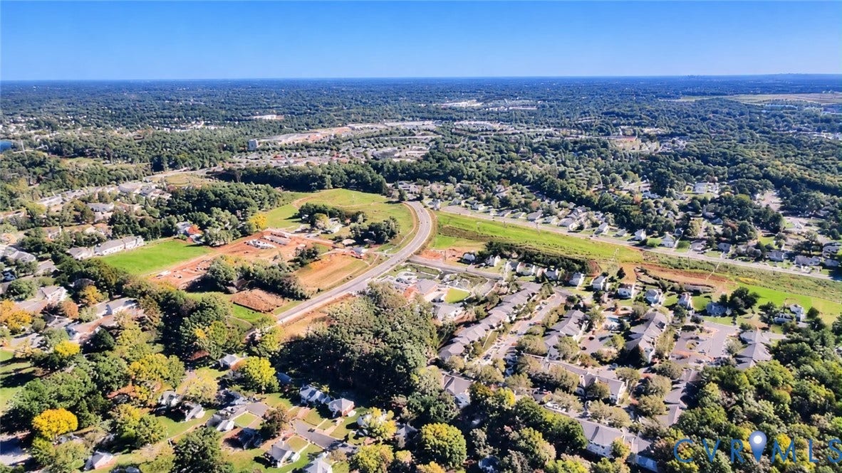 3207 Winchester Street, Henrico, VA 23231 Aerial perspective showcasing expansive suburban landscape, abundant mature canopy cover, extensive green space, and established road infrastructure