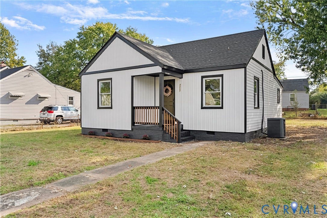 3207 Winchester Street, Henrico, VA 23231 Exterior featuring vertical board-and-batten siding, contrasting dark trim, a covered front porch with wood railing, and a gabled roofline