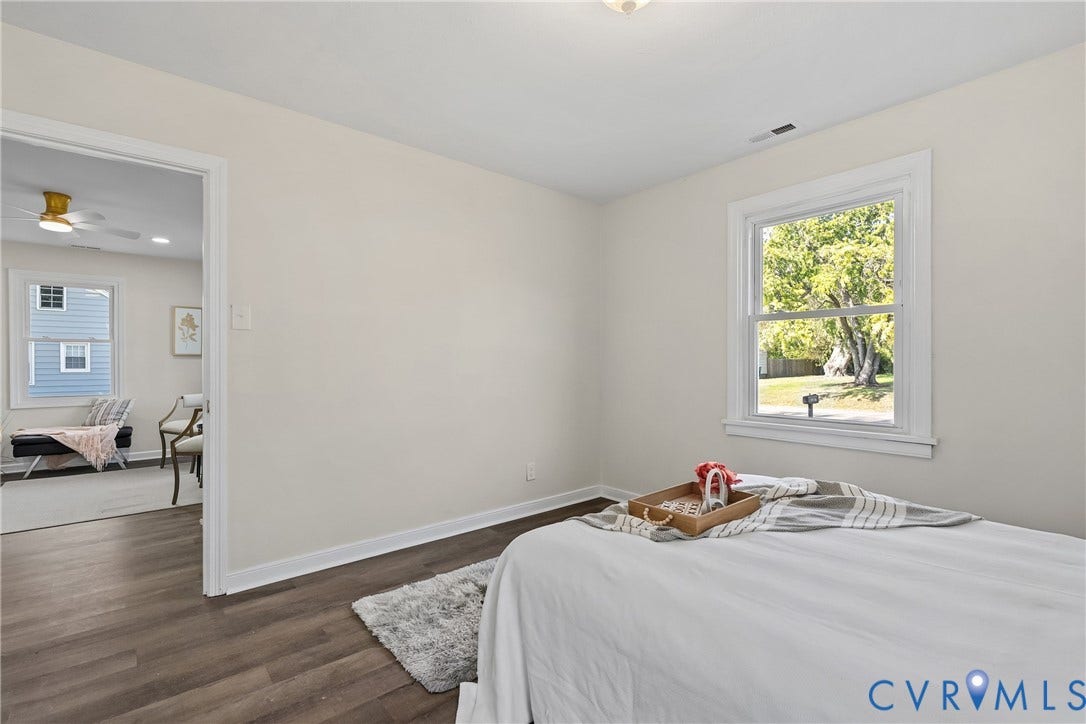 3207 Winchester Street, Henrico, VA 23231 Neutral-toned interior featuring wood-finish flooring, white window trim, and a double-hung window