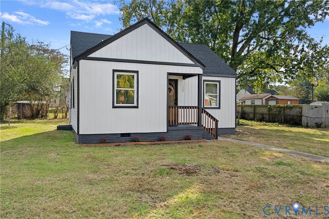 3207 Winchester Street, Henrico, VA 23231 Board-and-batten exterior with contrasting trim, asphalt shingle roof, covered front porch, and concrete walkway