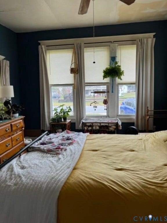 18194 S. Railroad Avenue, Boykins, VA 23827 Triple window assembly with white casings, ceiling-mounted fan, and dark-toned wall finish