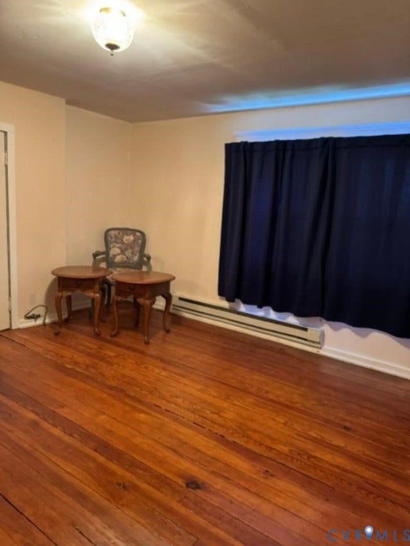 18194 S. Railroad Avenue, Boykins, VA 23827 Wood-finish flooring, interior door, ceiling-mounted light fixture, and horizontal heating unit