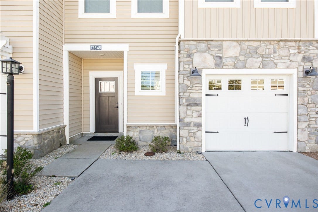 12548 Petrel Crossing, Midlothian, VA 23112 entry door, driveway, and garagef