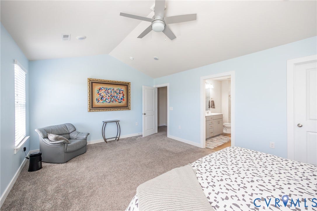 12548 Petrel Crossing, Midlothian, VA 23112 Vaulted ceiling featuring a central light-integrated ceiling fan, neutral wall-to-wall carpeting, and multiple interior doors