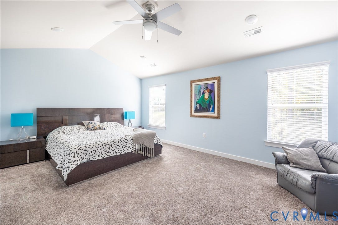 12548 Petrel Crossing, Midlothian, VA 23112 Spacious room featuring a vaulted ceiling, wall-to-wall carpeting, and multiple windows with installed blinds