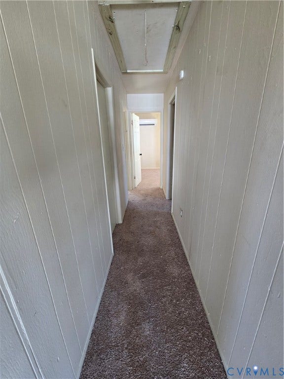320 Shore Street, Petersburg, VA 23803 Hallway featuring vertical paneling, carpet flooring, and ceiling attic access
