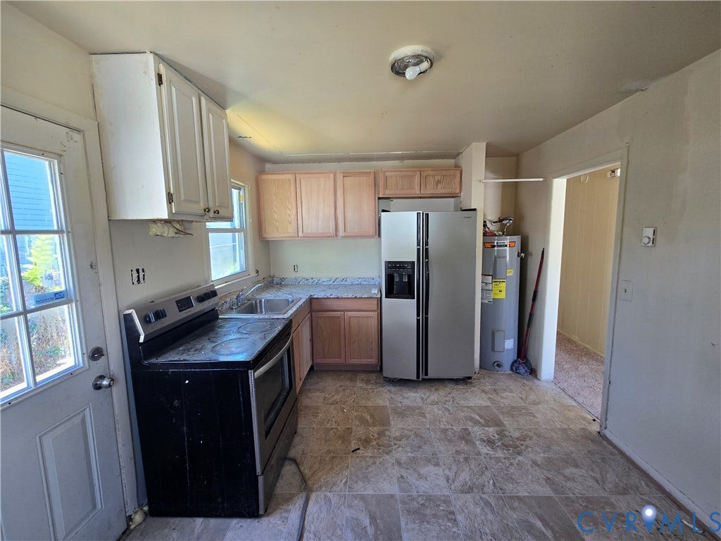 320 Shore Street, Petersburg, VA 23803 Kitchen featuring wood cabinetry, stone-patterned laminate countertops, stainless steel appliances, and tiled flooring
