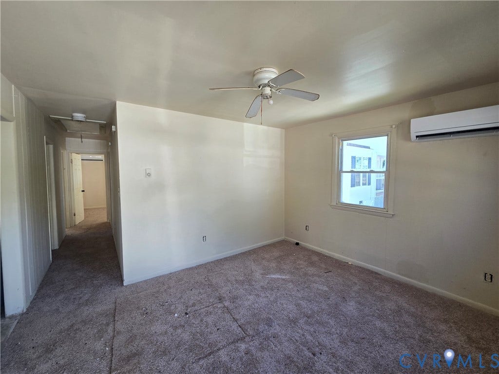 320 Shore Street, Petersburg, VA 23803 Room featuring neutral walls, carpeting, a ceiling fan, and a wall-mounted ductless heating and cooling unit