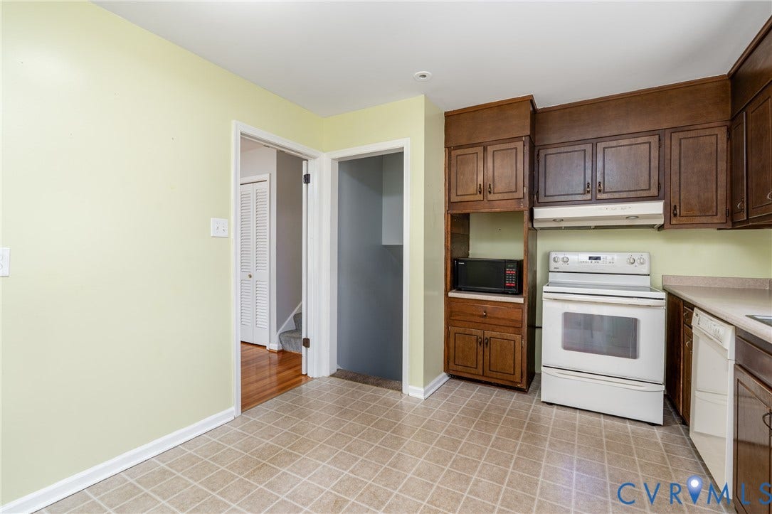 9329 Totopotomoy Trail, Ashland, VA 23005 Kitchen featuring stained wood cabinetry, white electric range, integrated hood, and tile flooring