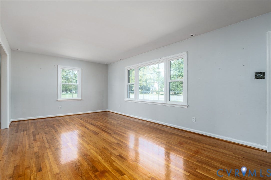 9329 Totopotomoy Trail, Ashland, VA 23005 Interior space featuring wood-finish flooring, neutral wall paint, and multi-pane windows