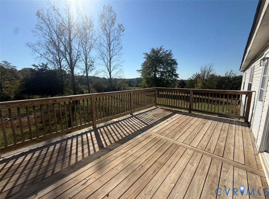 26691 Bell Road, Amelia, VA 23002 Elevated wood deck featuring vertical baluster railings and expansive natural scenery