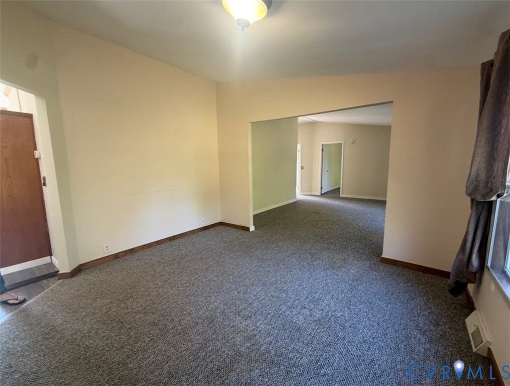 26691 Bell Road, Amelia, VA 23002 Interior space featuring neutral wall paint, gray carpeting, and a flush-mount ceiling light fixture