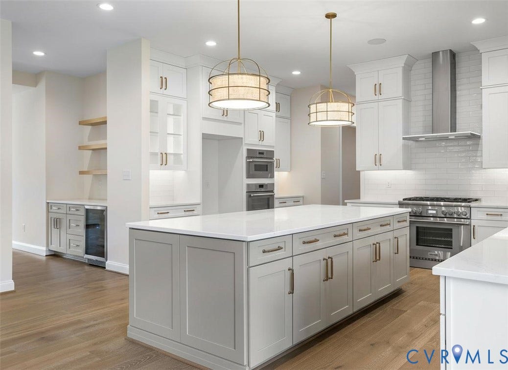 2851 Old Pump Road, Preserve At John Rolfe, Henrico, VA 23233 Kitchen featuring a central island with quartz countertops, custom shaker-style cabinetry, stainless steel professional-grade appliances, subway tile backsplash, and wood-finish flooring