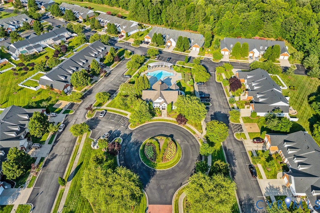 958 Wellston Court, Henrico, VA 23059 Aerial perspective of a multi-unit residential community featuring a central circular garden, swimming pool, structured parking areas, and mature tree-lined landscaping