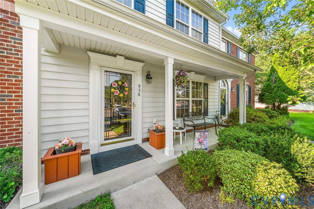 958 Wellston Court, Henrico, VA 23059 Covered front porch featuring a concrete foundation, square columns, architectural molding around the entryway, and exterior light fixtures