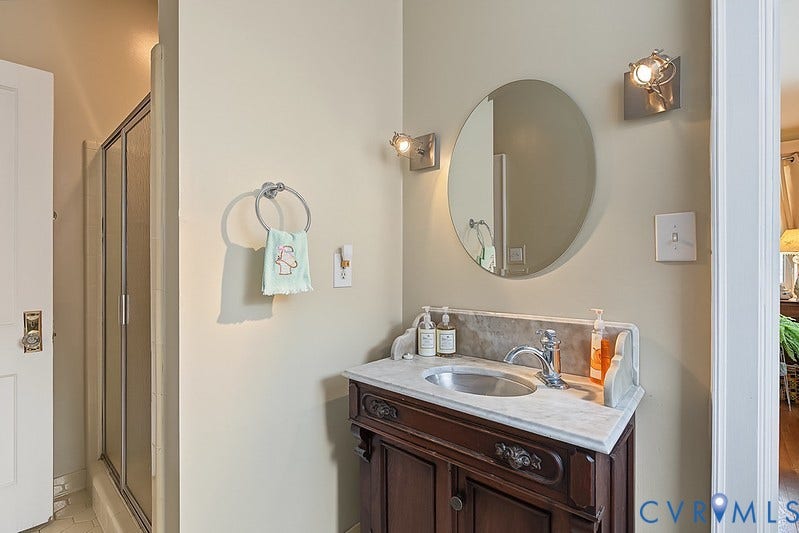 2923 Monument Avenue, #U2, Museum District, Richmond, VA 23221 Walk in tiled shower with antique marble basin.