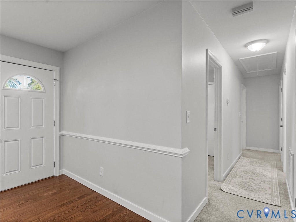 8708 Rainwater Road, Huntingcreek Hills, North Chesterfield, VA 23237 Entry featuring a white door with an arched window insert, wood-finish flooring, and chair rail molding