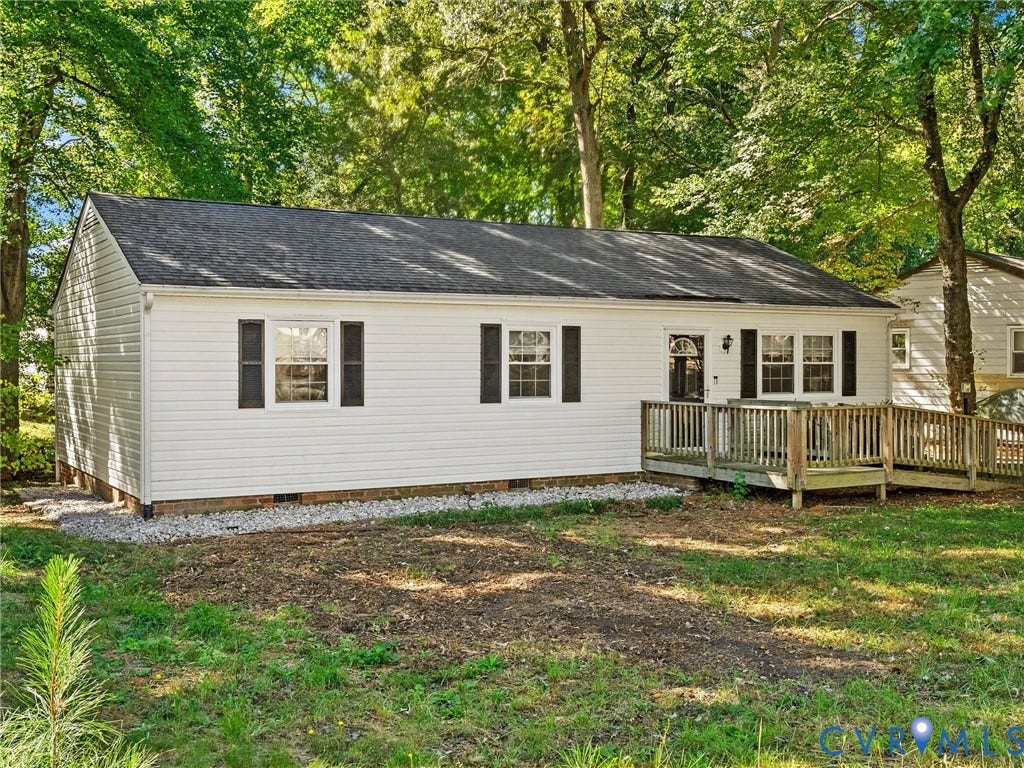 8708 Rainwater Road, Huntingcreek Hills, North Chesterfield, VA 23237 Single-story residence featuring horizontal white siding, dark shutters, an asphalt shingle roof, and a wood deck with a ramped entryway