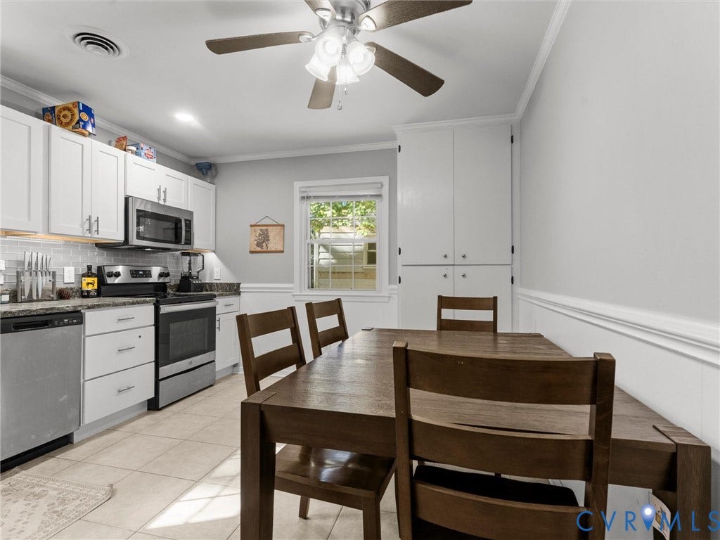8708 Rainwater Road, Huntingcreek Hills, North Chesterfield, VA 23237 Kitchen featuring white cabinetry, stainless steel appliances, tile flooring, built-in floor-to-ceiling pantry storage, and a ceiling fan with integrated lighting