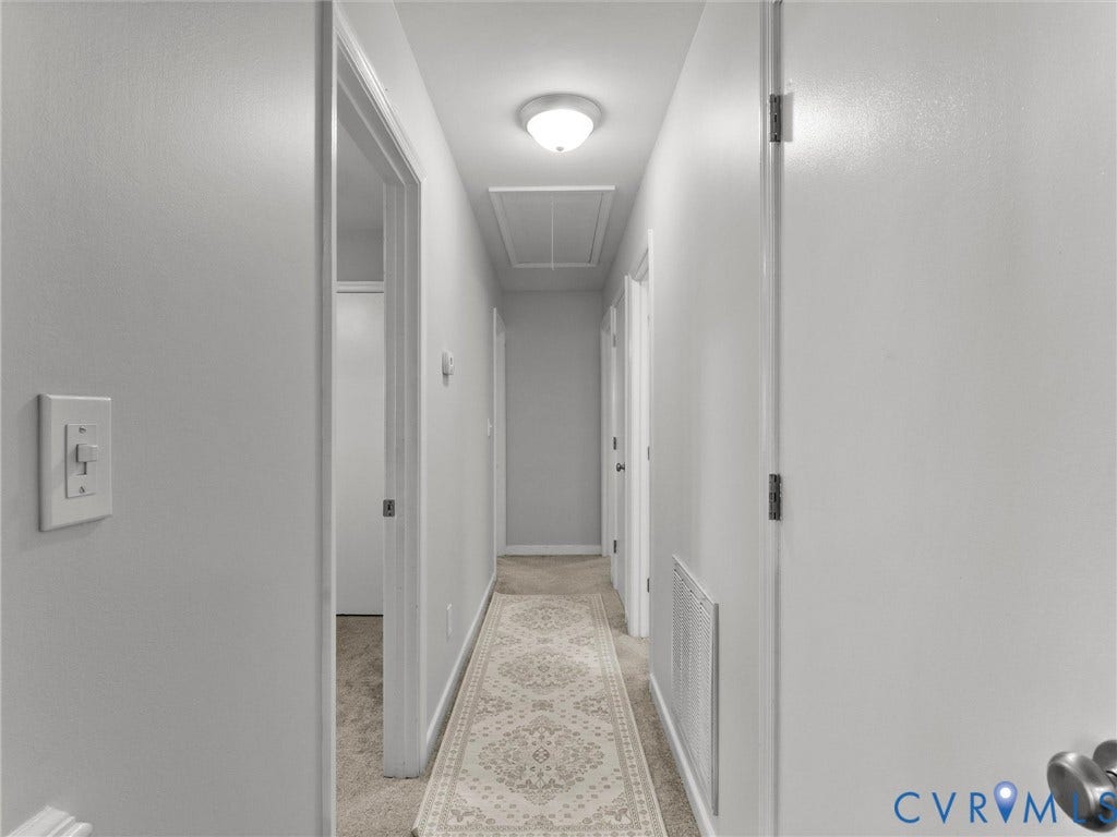 8708 Rainwater Road, Huntingcreek Hills, North Chesterfield, VA 23237 Hallway featuring neutral-toned carpeting, white interior doors, and a flush-mount ceiling light fixture