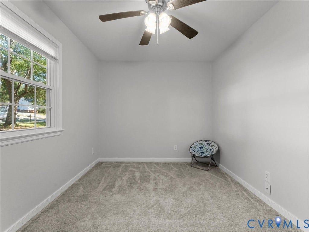 8708 Rainwater Road, Huntingcreek Hills, North Chesterfield, VA 23237 Neutral wall tones, wall-to-wall carpeting, double-hung window, and a ceiling fan with integrated light fixture