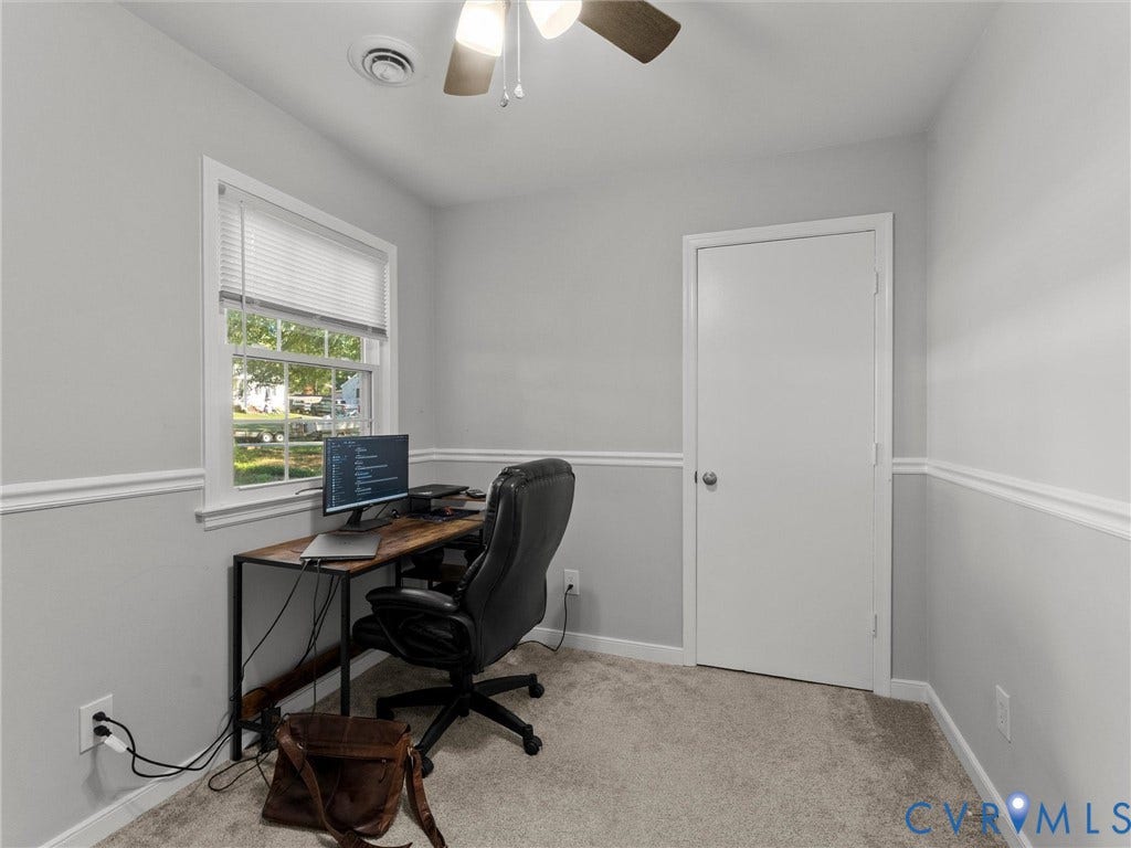 8708 Rainwater Road, Huntingcreek Hills, North Chesterfield, VA 23237 Interior room featuring neutral wall paint, white chair rail molding, wall-to-wall carpeting, a single-hung window with blinds, and a ceiling fan