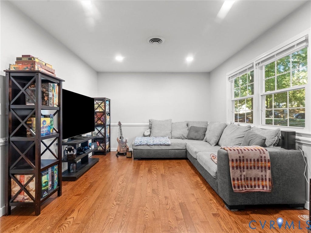 8708 Rainwater Road, Huntingcreek Hills, North Chesterfield, VA 23237 Living area featuring wood-finish flooring, recessed lighting, chair rail molding, and multi-pane windows