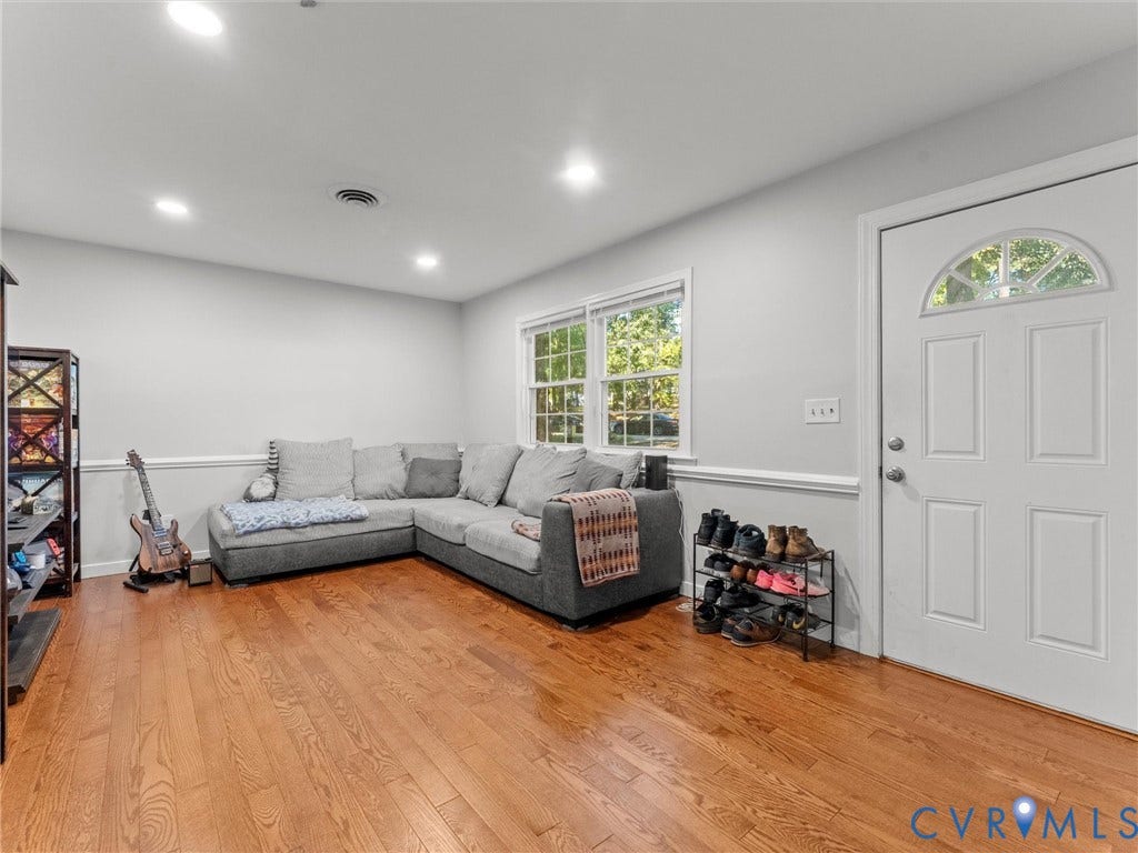 8708 Rainwater Road, Huntingcreek Hills, North Chesterfield, VA 23237 Interior space featuring wood-finish flooring, recessed lighting, chair rail molding, double-pane windows, and a solid-core entry door with an arched glass insert