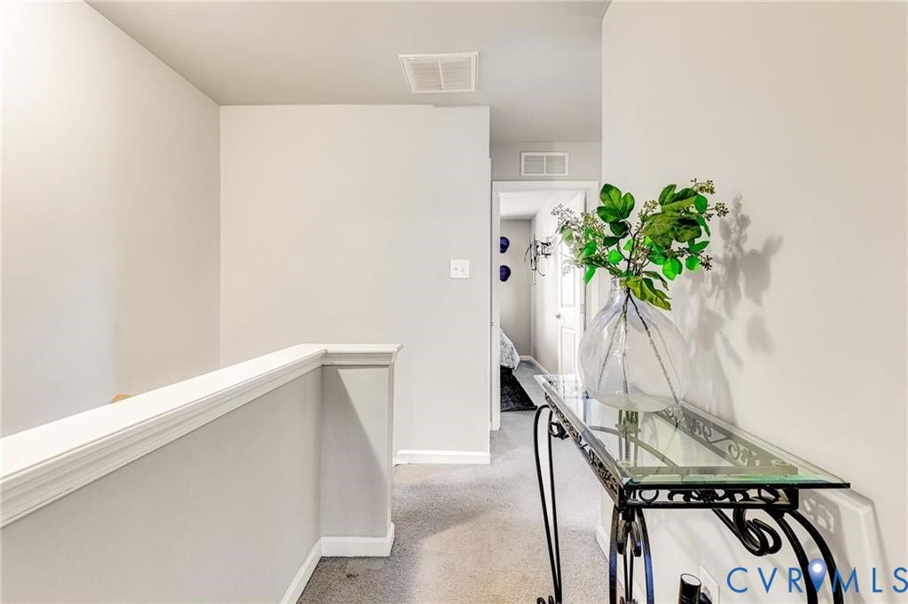 11600 Vicars Ridge Lane, Henrico, VA 23059 Hallway with an upstairs landing, carpet, visible vents, and baseboards