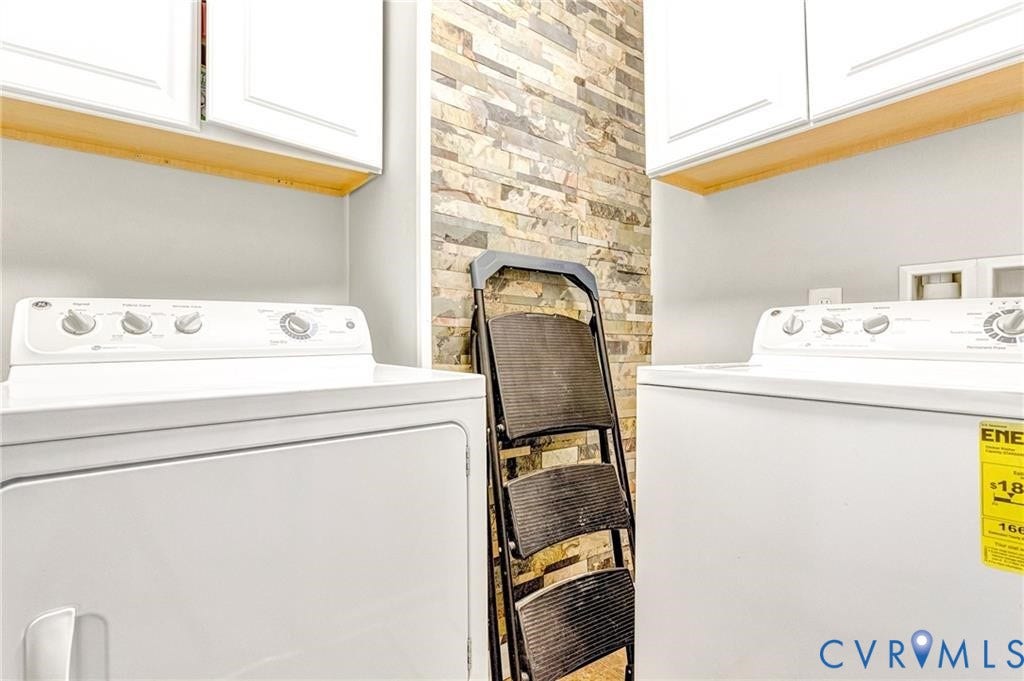 11600 Vicars Ridge Lane, Henrico, VA 23059 Washroom with cabinet space and washing machine and clothes dryer
