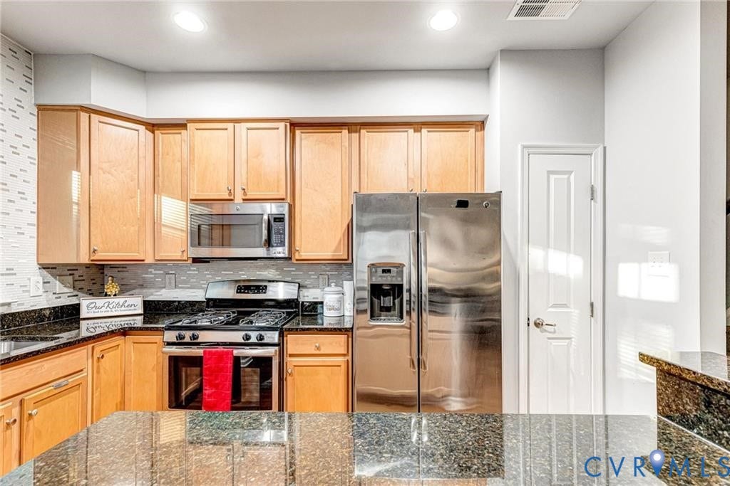 11600 Vicars Ridge Lane, Henrico, VA 23059 Kitchen featuring visible vents, dark stone countertops, recessed lighting, appliances with stainless steel finishes, and decorative backsplash