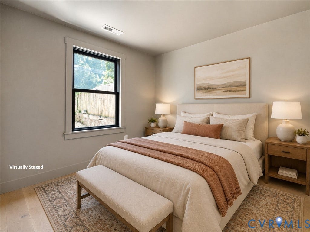 1708 Decatur Street, Swansboro, Richmond, VA 23224 Neutral interior walls, wood-finish flooring, and a single-hung window with a high-contrast dark frame