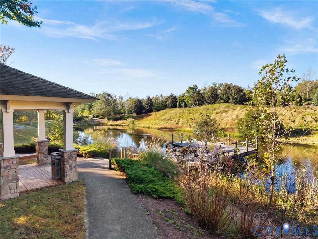 1412 Ascot Hill Terrace, Midlothian, VA 23112 Covered pavilion featuring stone-base columns and wood decking, paved walkway, private pond, and timber-frame dock with rope railings