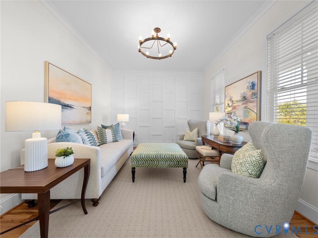 1412 Ascot Hill Terrace, Midlothian, VA 23112 Living area featuring white paneled accent wall, crown molding, circular chandelier, and horizontal window blinds