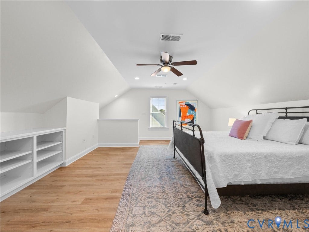 1412 Ascot Hill Terrace, Midlothian, VA 23112 Vaulted ceilings, wood-finish flooring, built-in white shelving, recessed lighting, and a centrally mounted ceiling fan