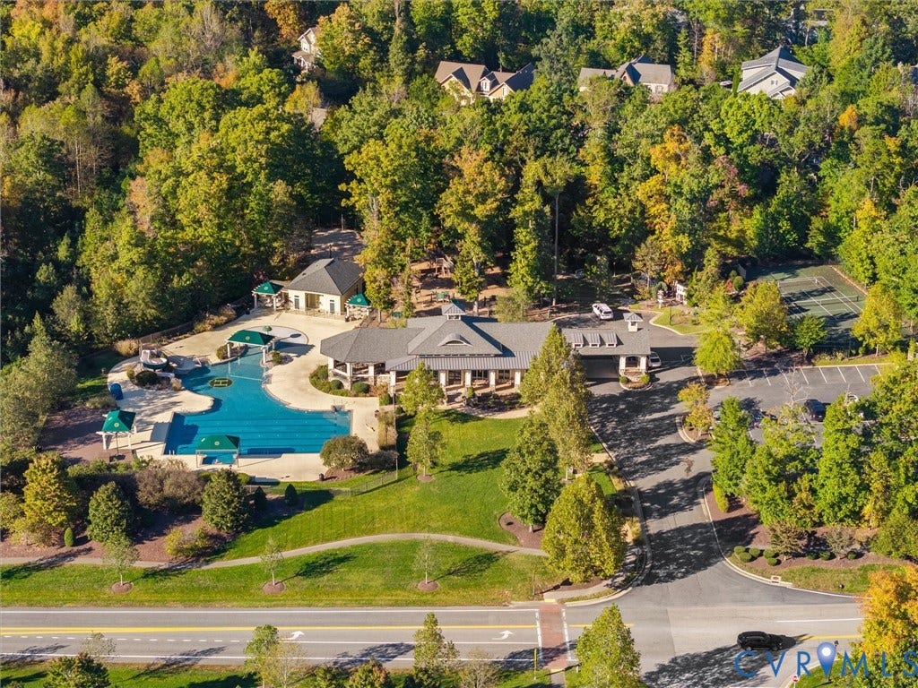 1412 Ascot Hill Terrace, Midlothian, VA 23112 Community facility featuring an outdoor swimming pool, tennis court, sprawling lawn, and paved parking area