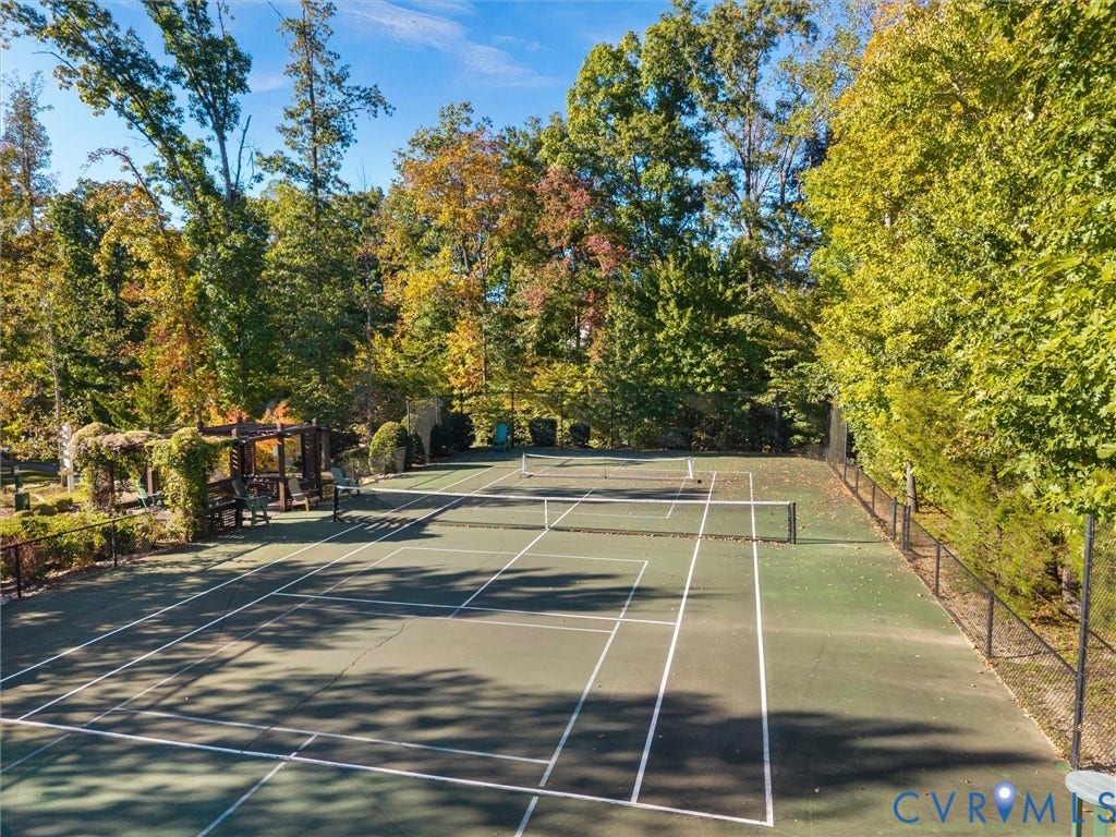 1412 Ascot Hill Terrace, Midlothian, VA 23112 Tennis court featuring a hard surface, perimeter fencing, and a wooden pergola structure