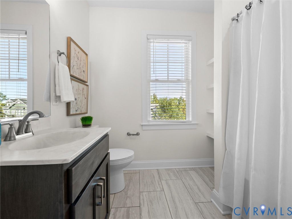 1412 Ascot Hill Terrace, Midlothian, VA 23112 Bathroom featuring a dark wood-finish vanity with a stone-top integrated sink, ceramic tile flooring, a shower-tub combination, and built-in wall shelving