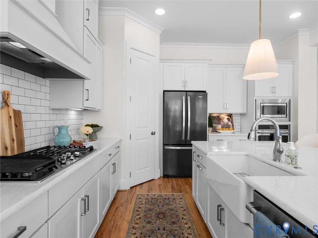1412 Ascot Hill Terrace, Midlothian, VA 23112 Kitchen featuring white cabinetry, subway tile backsplash, farmhouse-style apron sink, stone countertops, and stainless steel appliances